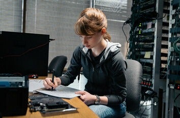 Student engaging in written homework.